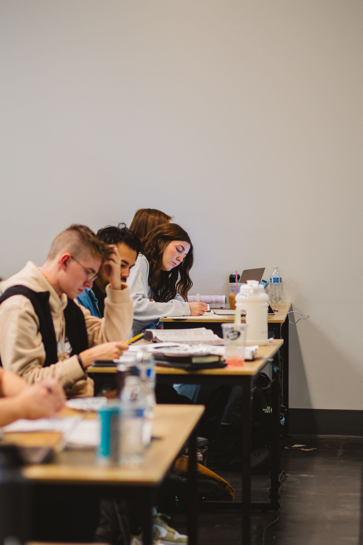 Part-time students studying together in class
